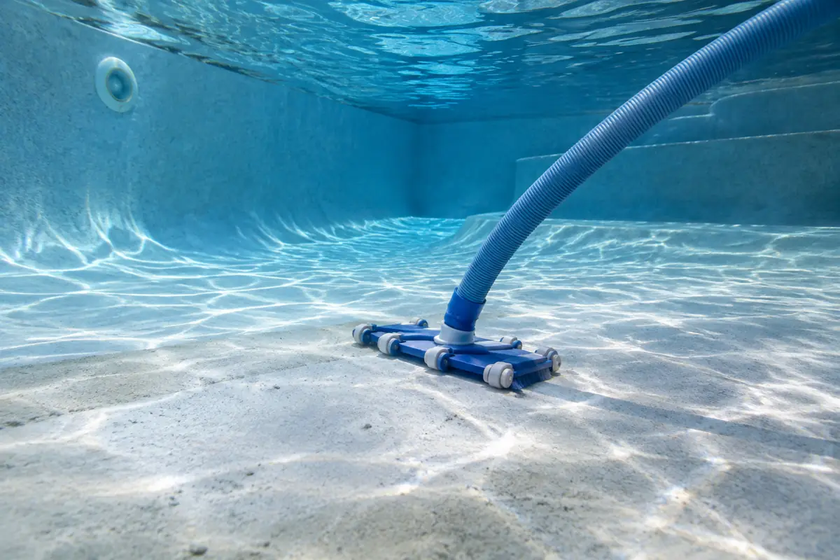 Flocculant settles particles on the pool floor overnight; they must be vacuumed to waste, not through the filter.