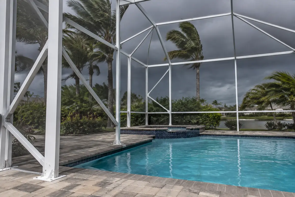 Screen enclosures and other structures around a Miami pool are designed to Miami-Dade's High-Velocity Hurricane Zone wind speeds.
